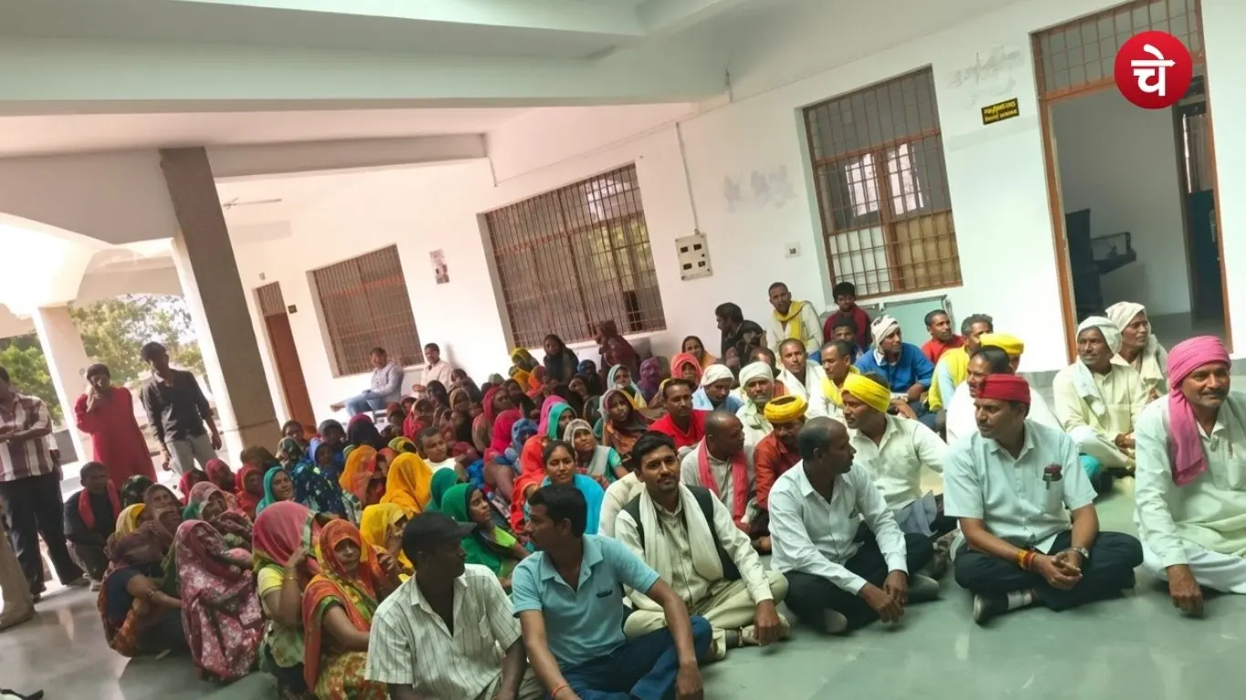 Tribal villagers protesting in the Manikpur tehsil complex in Chitrakoot over allegations of a ban on farming